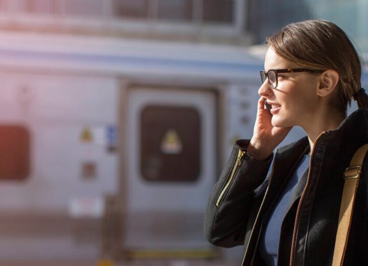 Woman Waiting At Train Station Platform.