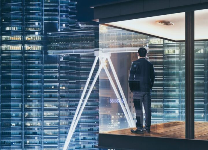 Person Overlooking City Skyline At Night