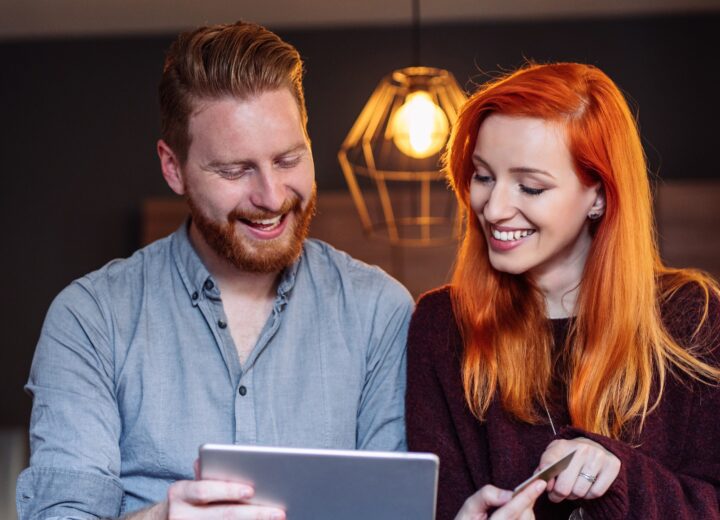 Couple Sharing A Tablet Together.