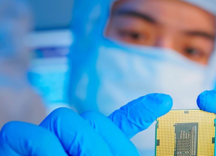Person Holding A Semiconductor Chip.