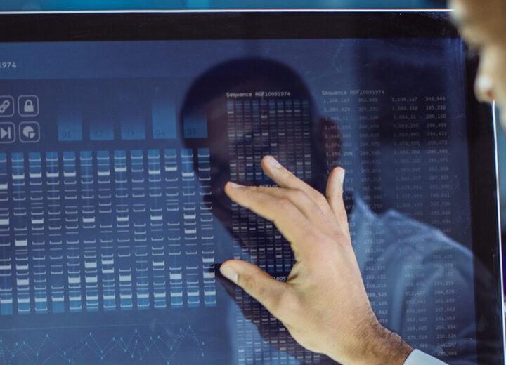 Person Interacting With Data On Screen.