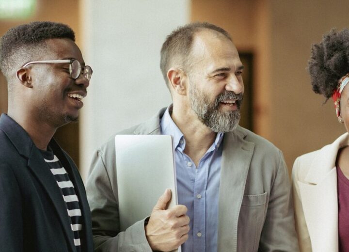 Group Of Diverse Professionals Discussing Together.