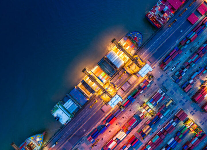 Aerial View Of Illuminated Shipping Port.