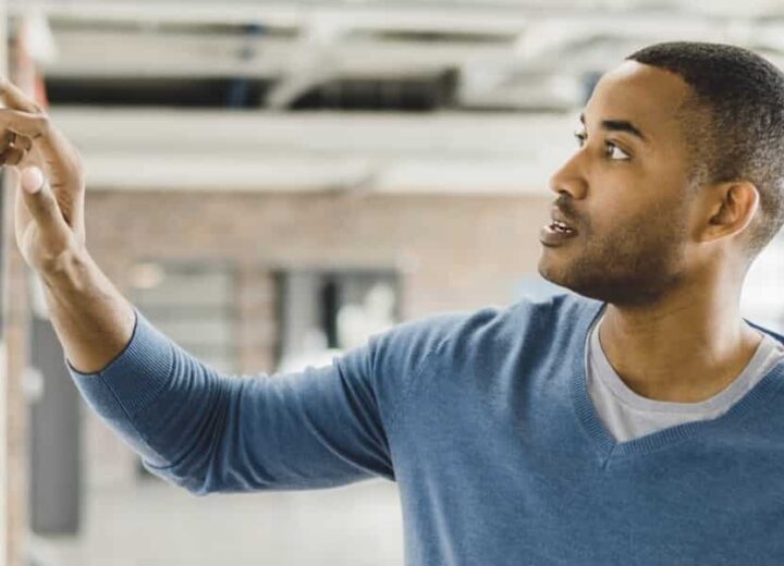 Analyzing Data On A Wall Chart.