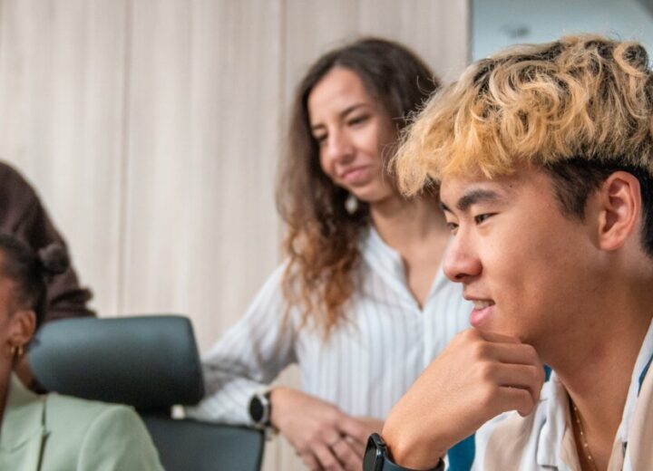 Group Of People In A Meeting.