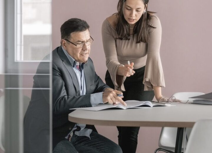Business Meeting In Modern Office Setting.