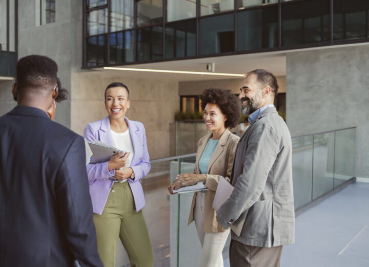 Group Of Professionals Discussing Ideas.